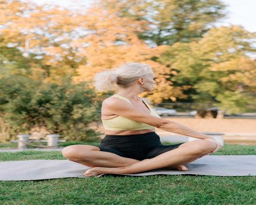 Senior people stretching in a park outdoors