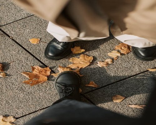 Pair of walking shoes on pavement